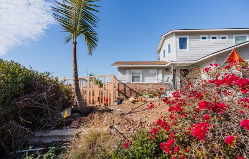 A single family home in Escondido with a under construction ADU unit in the front yard.