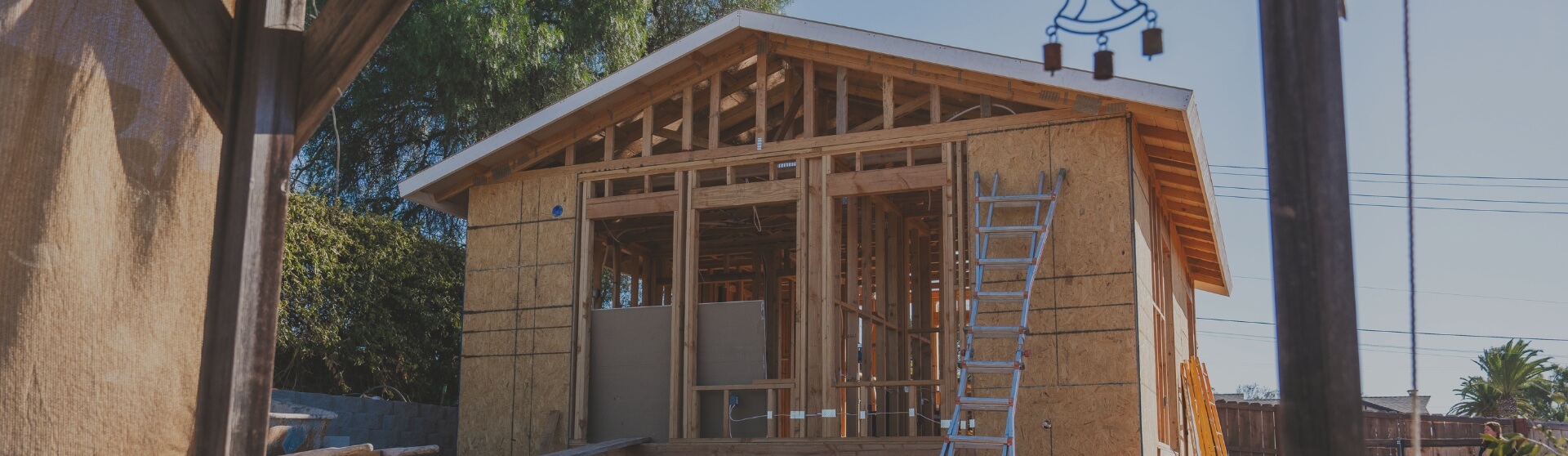 A partially built ADU in Imperial Beach with exposed framing and construction tools, reflecting the early stages of development.