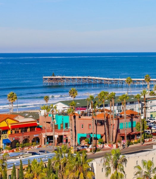 Scenic coastal view by Pacific Beach ADU builder, highlighting vibrant beachfront properties and serene ocean backdrop.