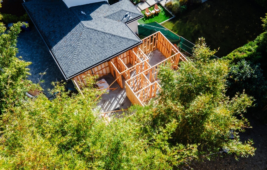 A top-down view of an ADU build in progress, surrounded by lush greenery in Spring Valley.