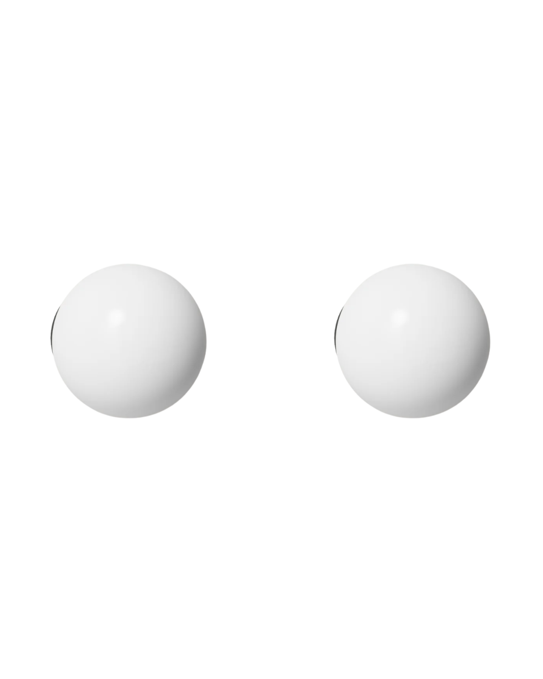 Two minimalist white globe-shaped vanity lights.