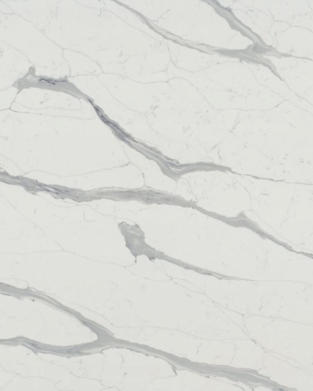 White quartz countertop featuring prominent grey marble-like veining throughout.