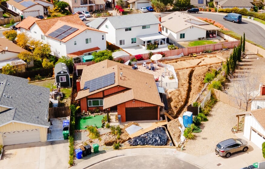 Aerial view of ADU construction in suburban neighborhood for adu floor plans 800 sq ft FAQs section