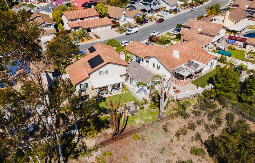 Aerial view of residential properties suited for 880 sq ft ADU plans, showcasing typical San Diego neighborhood layout.