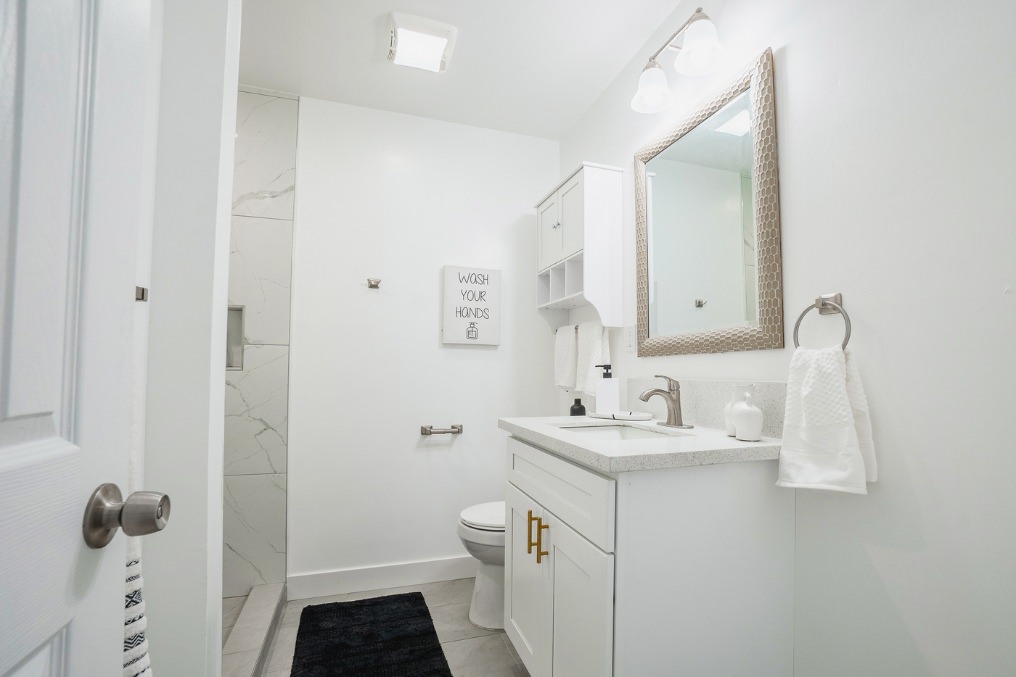 Sleek bathroom vanity with modern fixtures and elegant decor in La Mesa ADU.