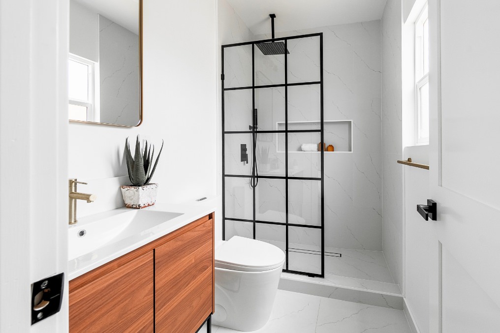 Sophisticated bathroom with contemporary glass-paneled shower and sleek fixtures