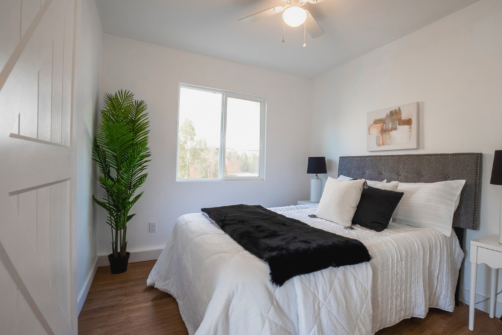 Cozy, contemporary bedroom in La Mesa ADU with neutral decor and bright natural light.