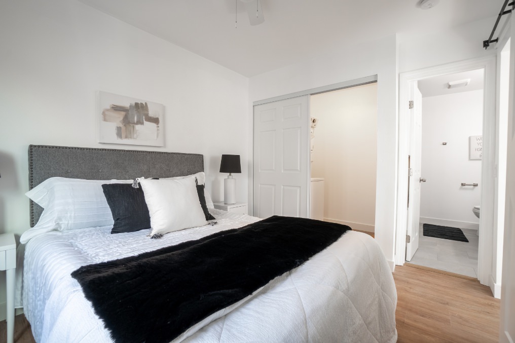 Bedroom featuring spacious closet and bathroom access in La Mesa garage conversion.