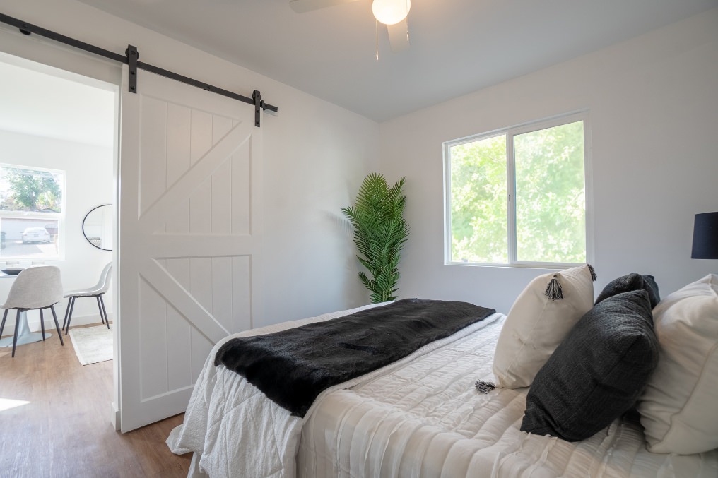 Sliding barn door view from bedroom to living space in La Mesa ADU.