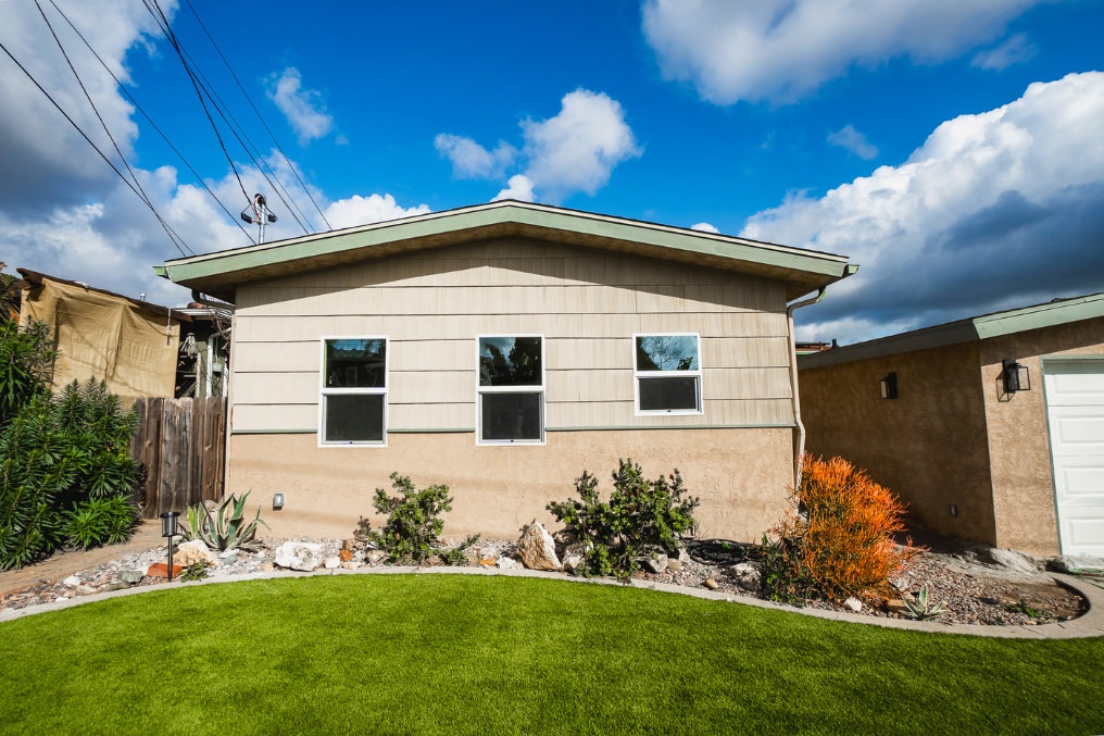 Exterior of La Mesa garage conversion ADU with landscaped yard and modern finish.