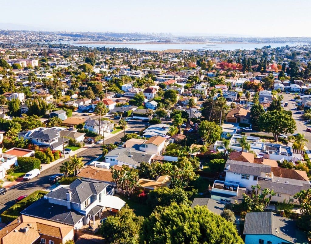 Aerial view of a vibrant San Diego neighborhood, highlighting diverse residential properties and landscape.