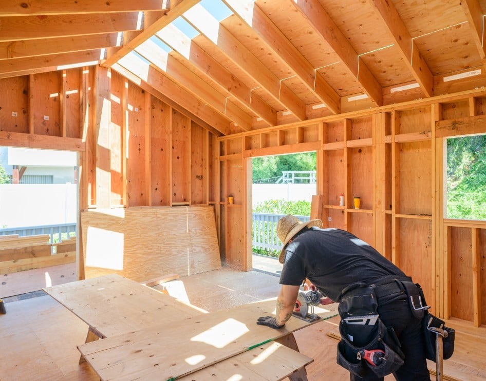 Construction site showing framing of an ADU highlighting the misconception that cost per square foot is not a reliable metric.