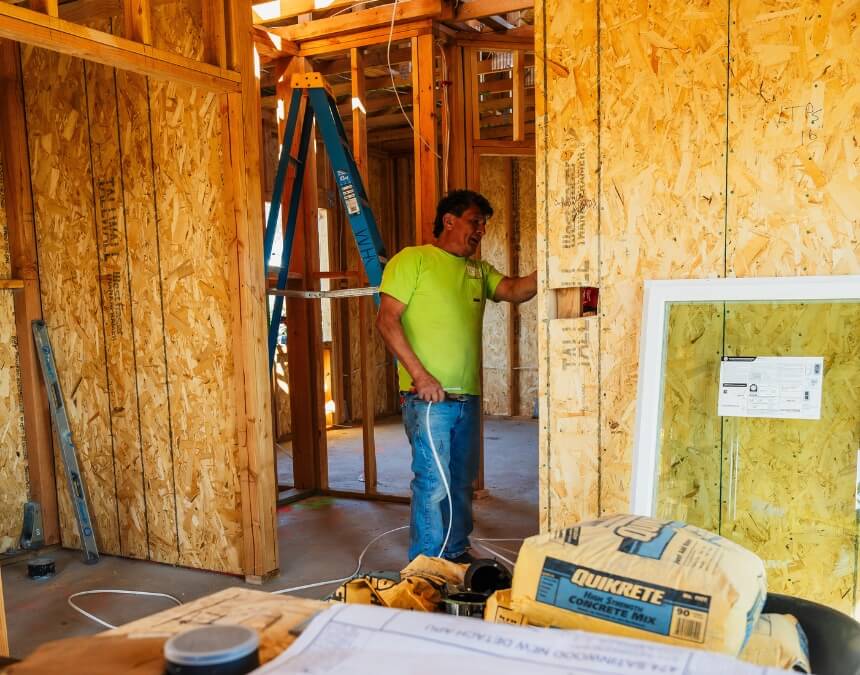 Choosing the Right Electrical Contractor – electrician wiring an ADU under construction.