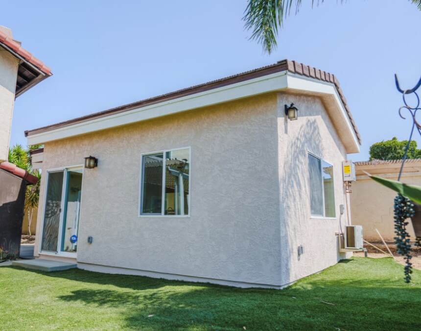Completed ADU exterior with visible electrical and utility connections.