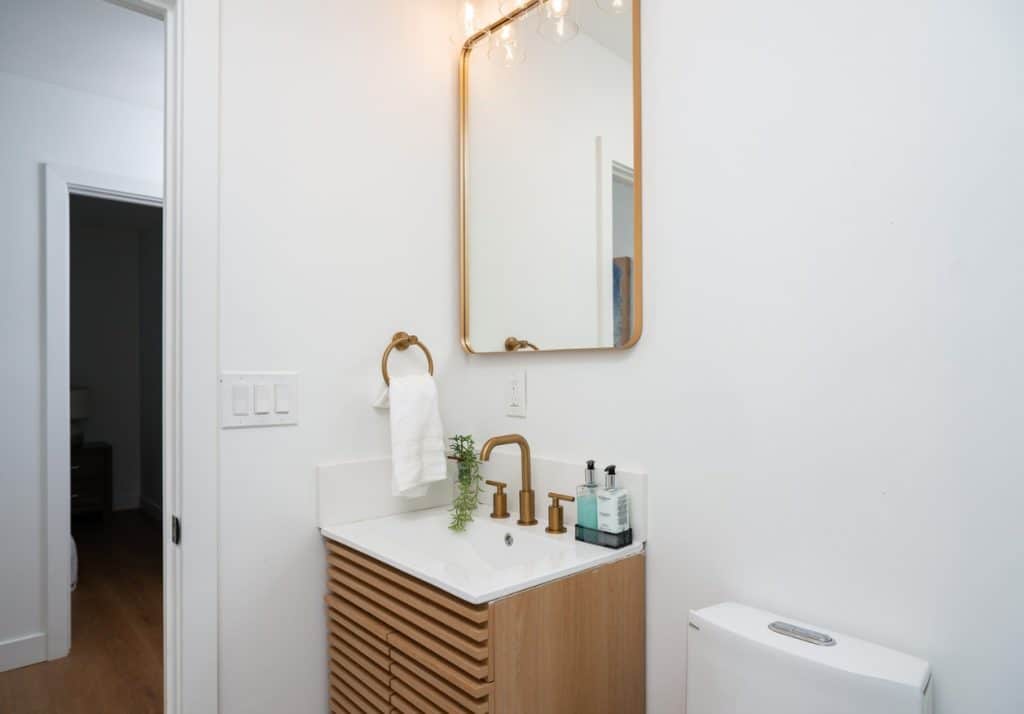 Modern bathroom interior with sleek fixtures, highlighting high-quality finishes possible in an ADU.