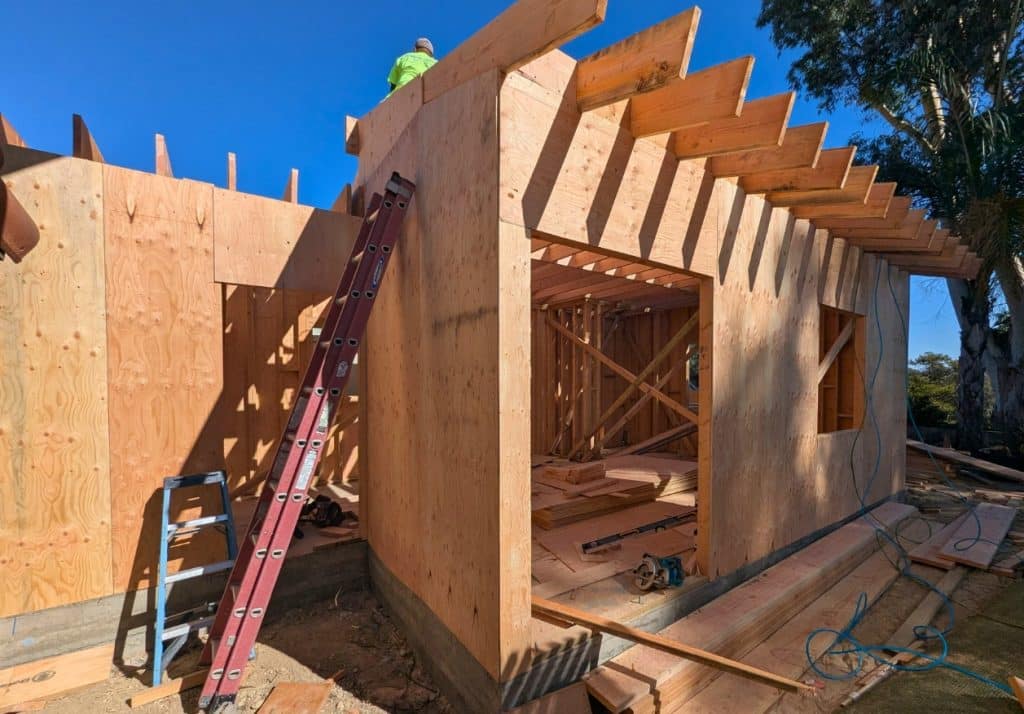 Construction site showing framing in progress, illustrating common pitfalls and how to avoid them when applying for ADU Bonus Program permits.