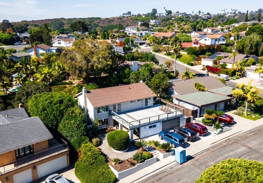 Aerial view of a suburban neighborhood showcasing homes with potential backyard space for ADUs or tiny houses.