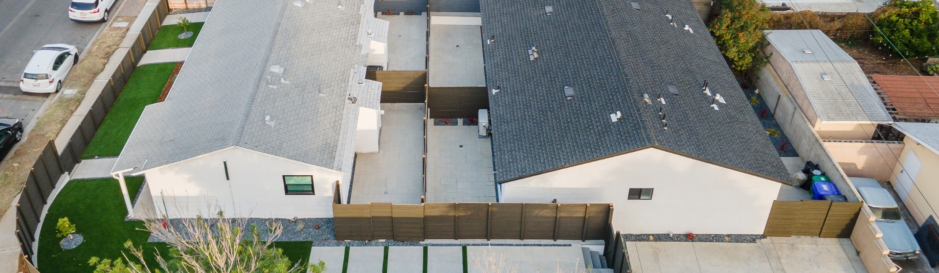 Aerial view of two modern ADUs side-by-side, illustrating the benefits of San Diego’s ADU Bonus Program for expanding property potential.