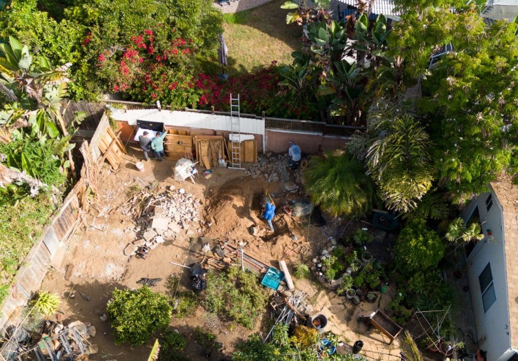 Overhead view of backyard guest house construction with zoning compliance.