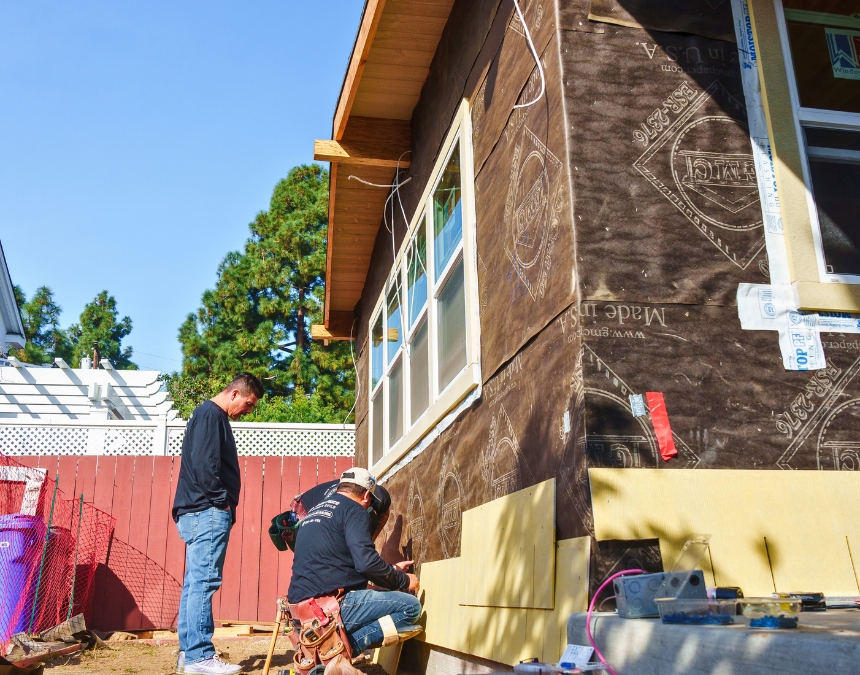 Workers on site building an ADU