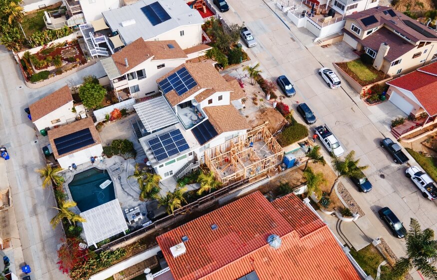 Aerial view of residential construction showing a 1000 sq ft ADU being built in a suburban San Diego neighborhood, highlighting real-life application and integration.