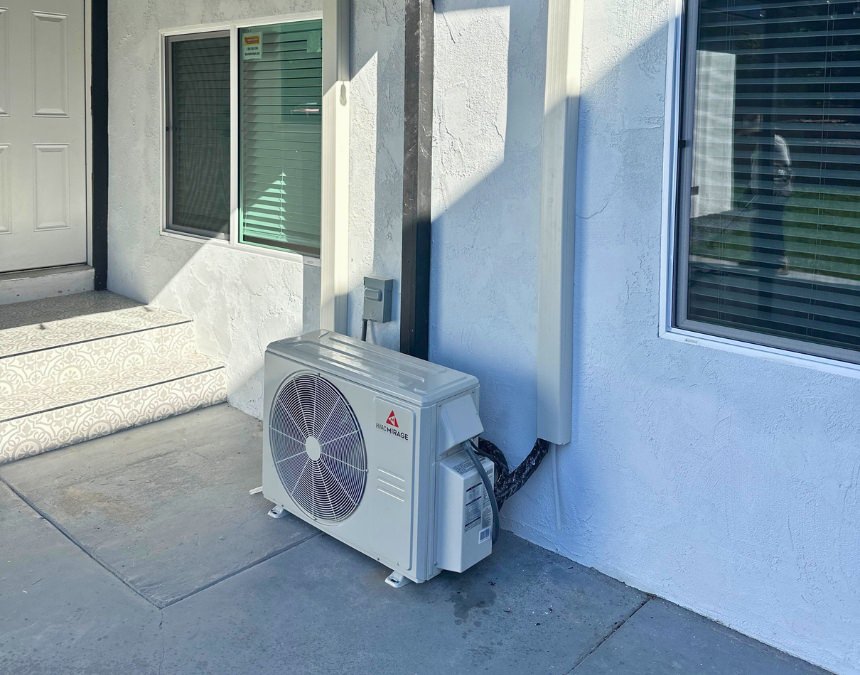 Title 24 HVAC efficiency standards - energy-efficient heat pump installed outside an ADU.