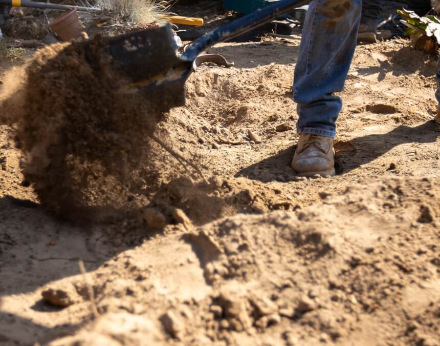 Shovel turning soil for ADU testing – How Long Does a Soils Test and Geotechnical Report Take to Complete