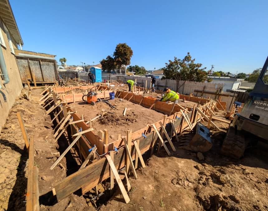 Contractor inspecting septic install maintenance tips for ADU septic systems
