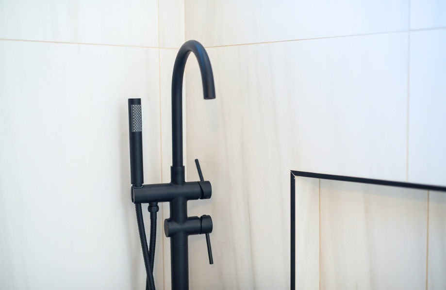 Matte black shower fixture detail from Sumac 985 SQ FT 2 bedroom 2 bath ADU plans, highlighting modern bathroom design elements.
