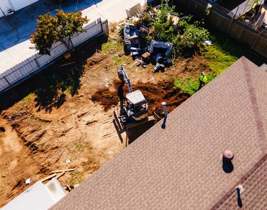 Digging tool collecting soil for inspection – What is a Soil Report and When is it Necessary