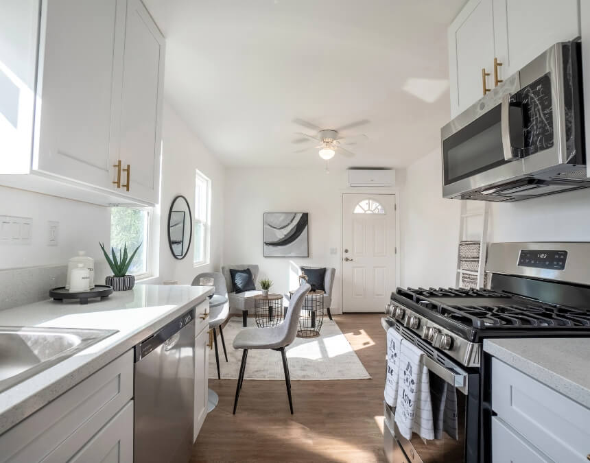 Enhancing Your ADU Kitchen with Better Place Design & Build showing modern kitchen with seating and plants