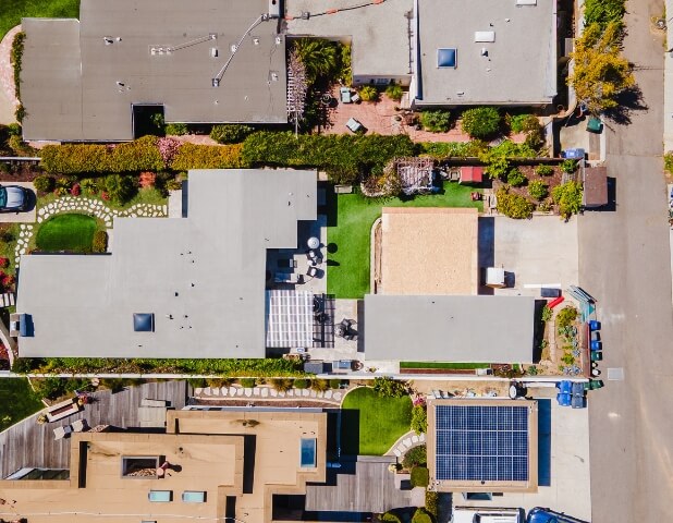 Backyard of a San Diego home with artificial turf and no visible driveway expansion, illustrating flexibility in ADU parking requirements – Parking Rules