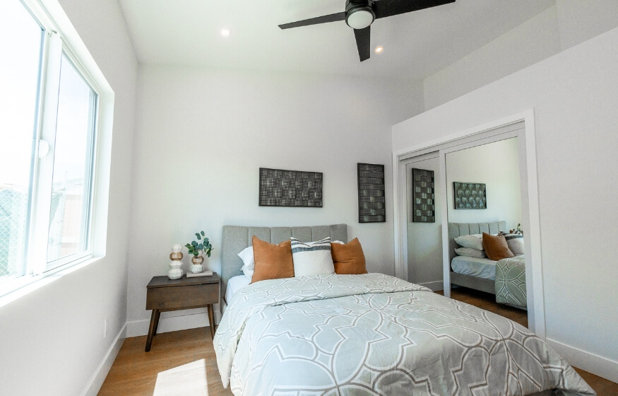 Interior view of a bright, modern 600 sq ft ADU bedroom used in the designer recommendation section, showcasing layout balance, natural light, and minimalist decor.
