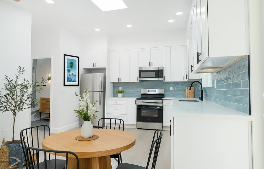 Interior view of a modern 600 sq ft ADU kitchen and dining space, featured in the "Popular 600 sqft ADU layouts" section to showcase open-concept living.