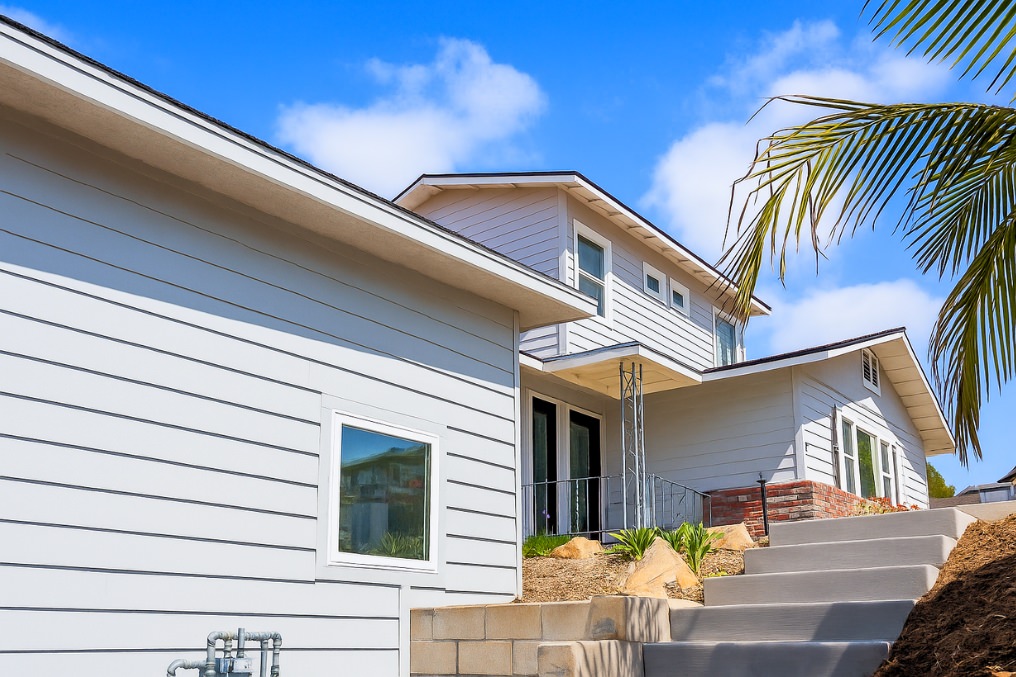 Entryway stairs and landscaping leading to the front door of modern attached coastal ADU.