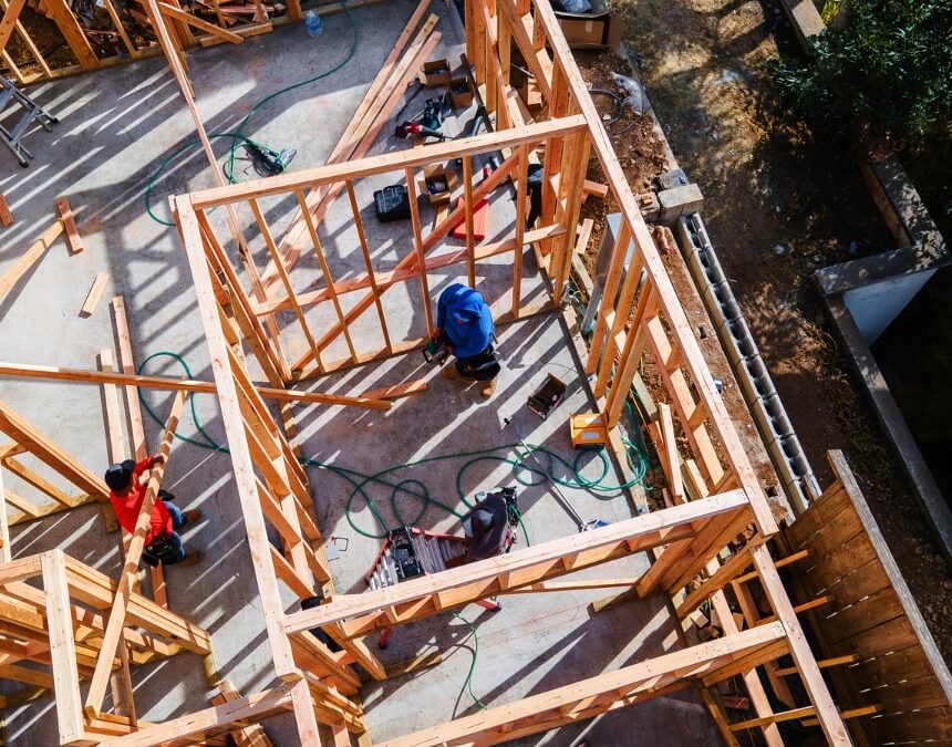 Foundation forms and trenches prepared for ADU construction in a residential backyard