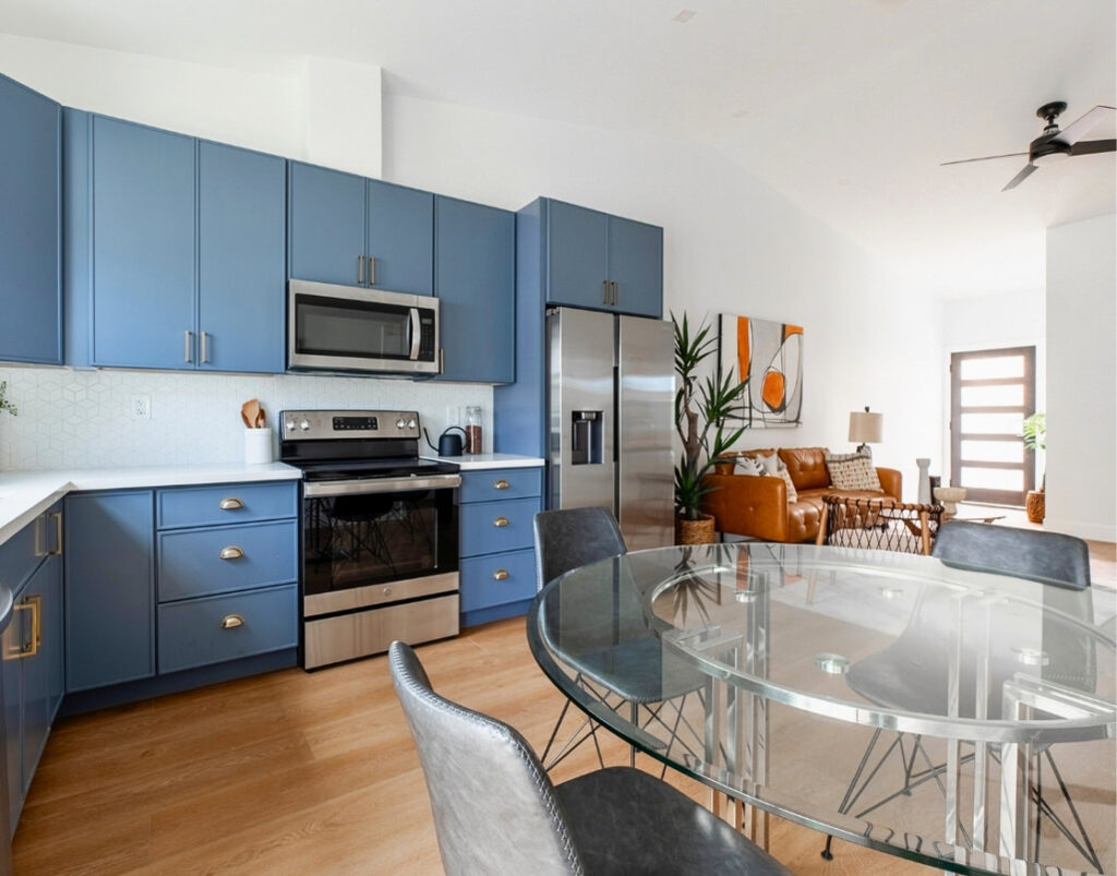 Image of modern ADU with blue cabinetry and open-concept living space