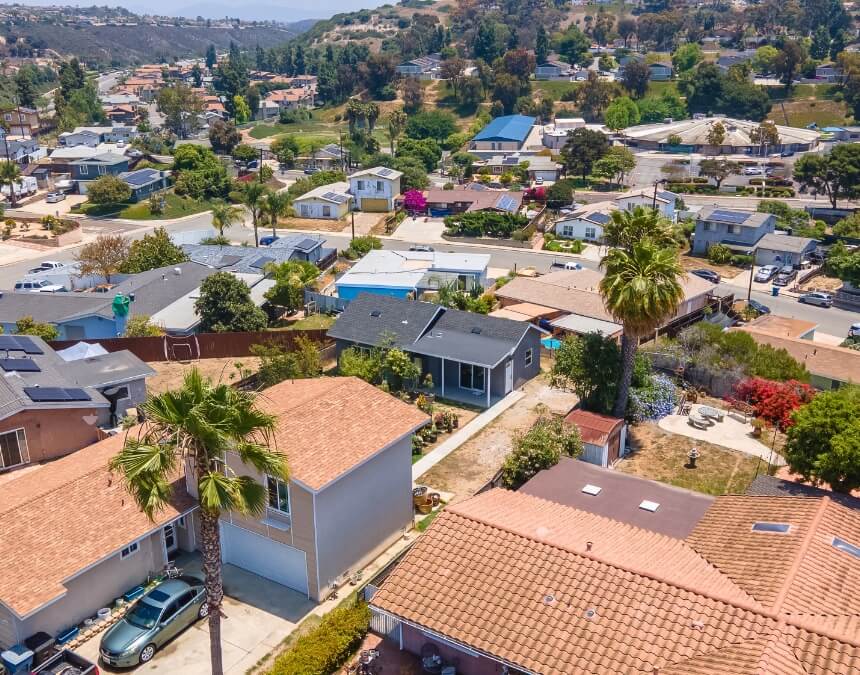 View of a residential neighborhood with backyard ADUs visible.