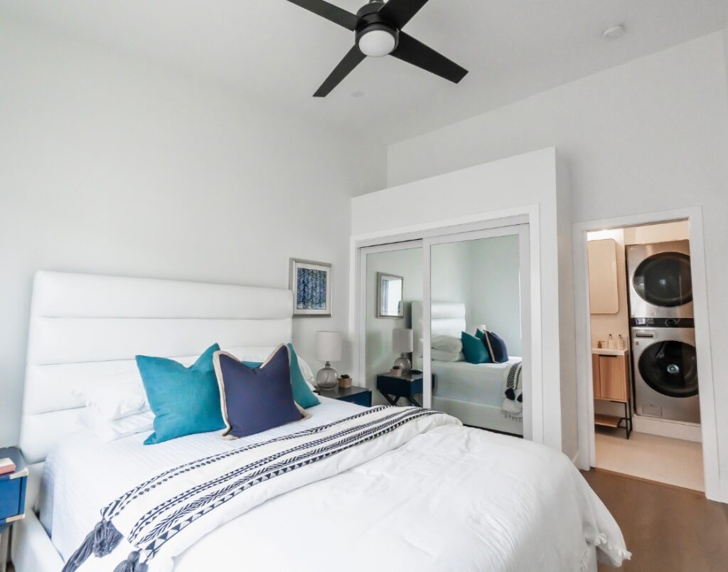 Pacific Beach Modern Luxe 4 illustrating peaceful bedroom with integrated laundry area.