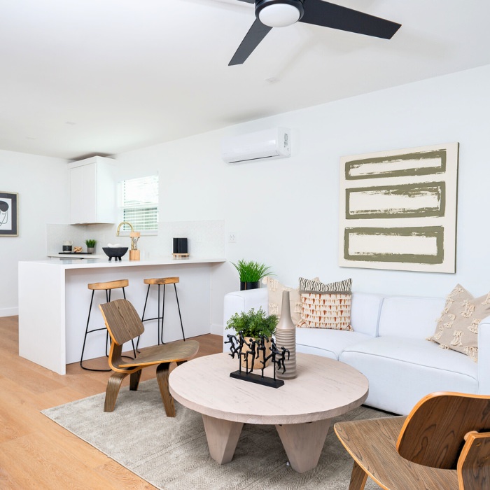 Modern ADU living room design by professional San Diego ADU builders featuring open concept with kitchen island.