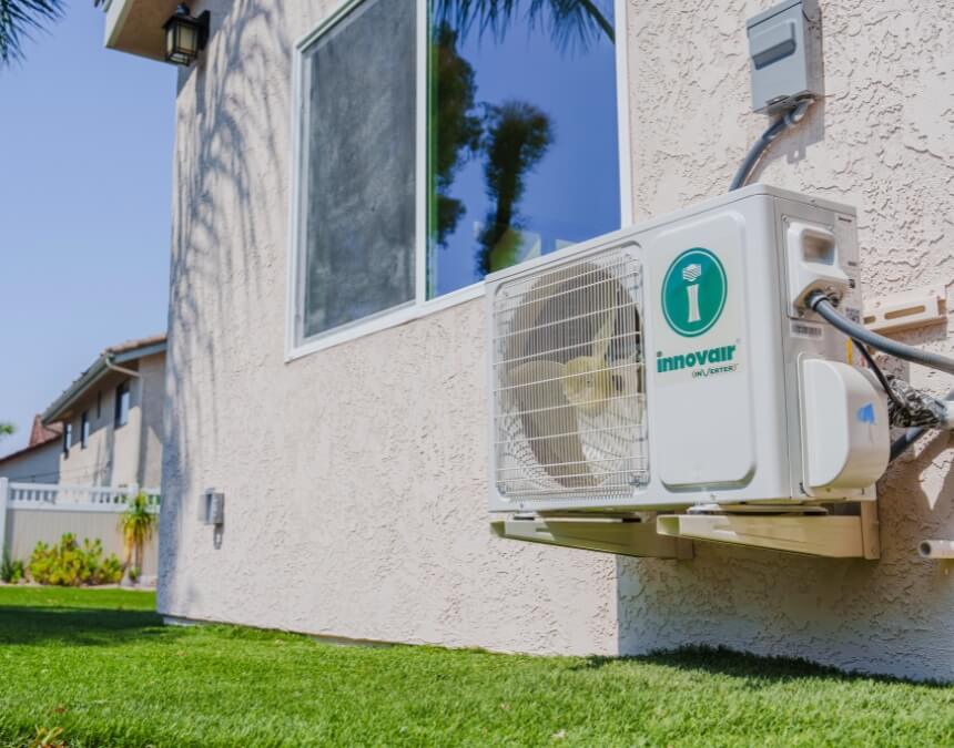 Mini-split HVAC system installed on an ADU exterior wall, factored into electrical load calculations for code compliance.