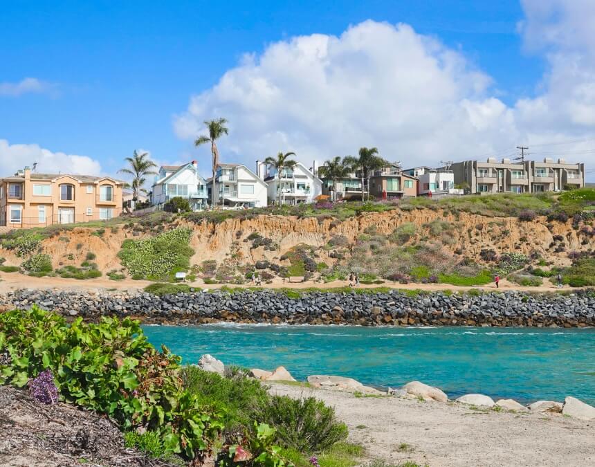 Importance of Stormwater Management in ADUs – Coastal homes along bluffs with visible stormwater risks.