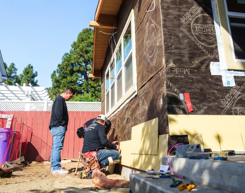 Contractor overseeing installation of exterior electrical wiring and circuits for ADU lighting and power distribution.