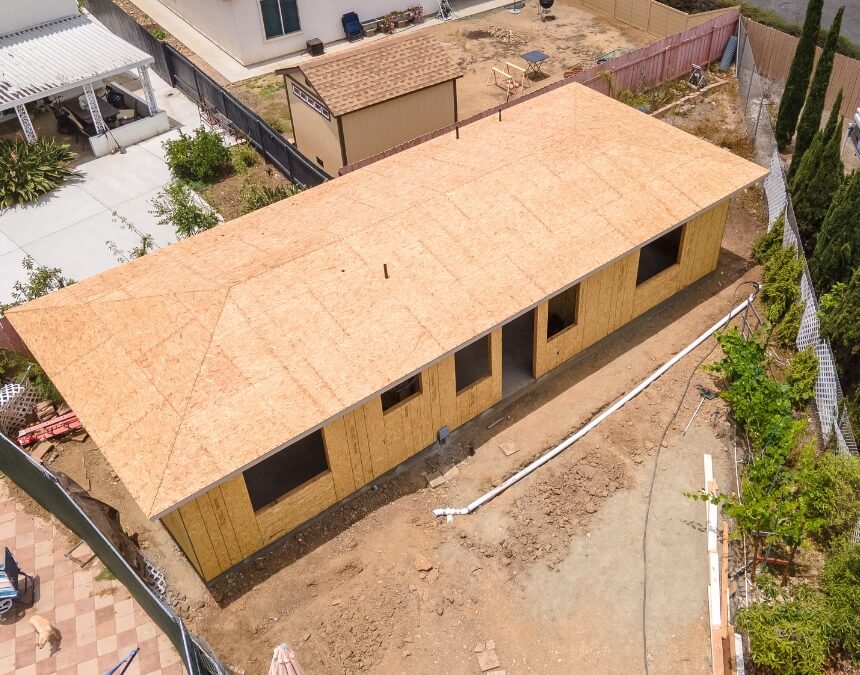Planning for Stormwater Management in ADU Projects – ADU under construction with visible grading and utility preparation.
