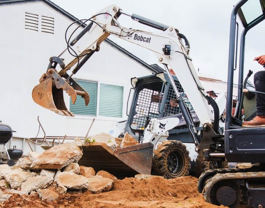 Techniques and Strategies – Excavation equipment preparing site drainage for ADU construction.