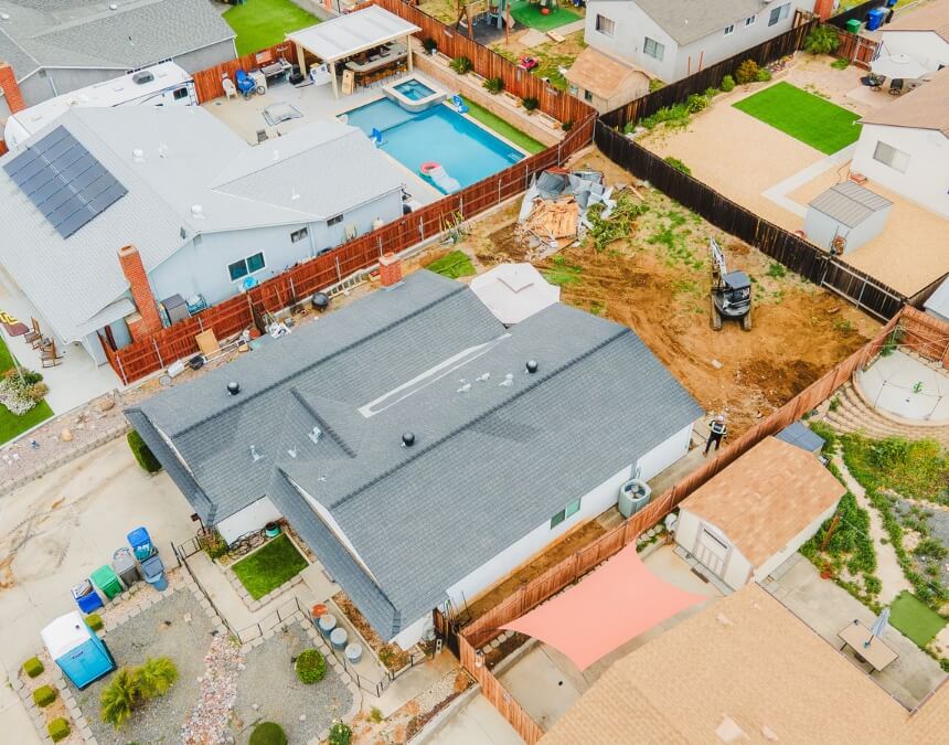 Benefits of Conducting a Feasibility Study – ADU site preparation and contractor reviewing project details.