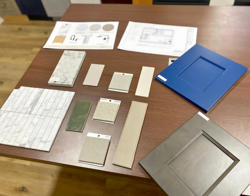 Key Components of a Feasibility Study – ADU material samples and design planning layout on table.