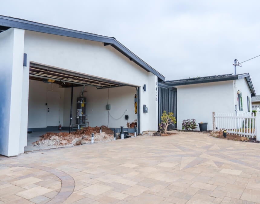 Types of ADUs with study tie-ins – garage conversion ADU in progress with exposed utilities and foundation work.