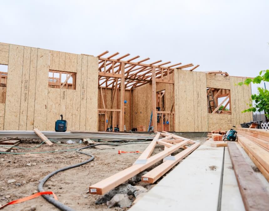 Aerial view of a San Diego home with a detached ADU and solar panels under construction.