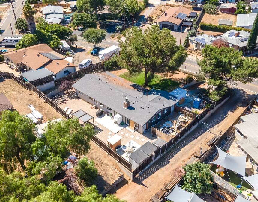 ADUs as an Investment showing a residential property with solar panels and space for additional housing units in a California neighborhood.